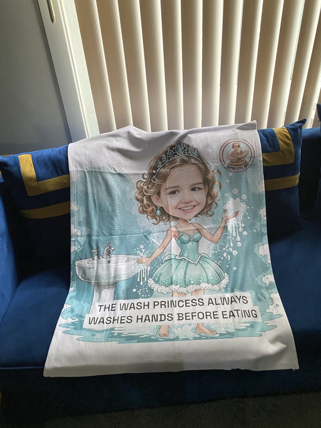 Wash-princess blanket displayed on a couch