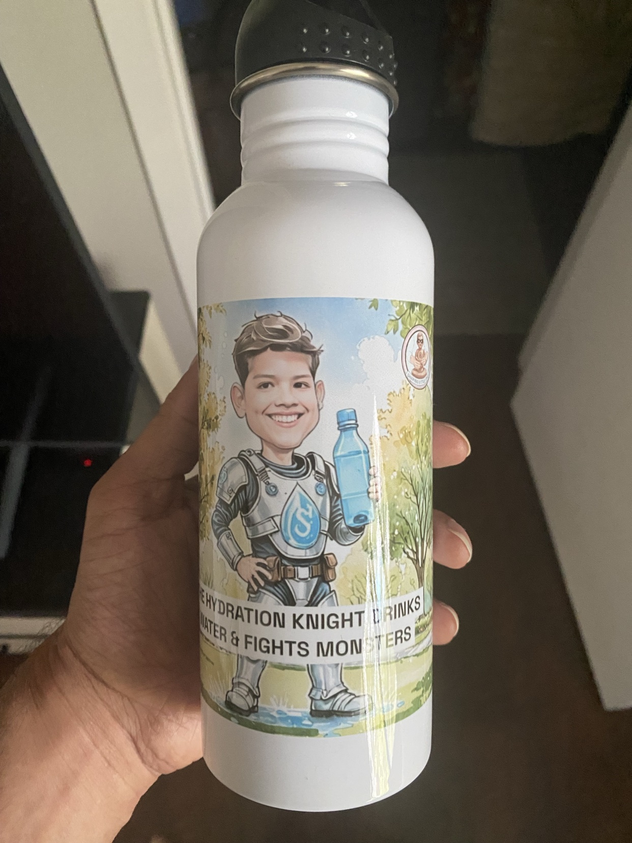 White stainless steel water bottle printed with a boy Hydration Knight character